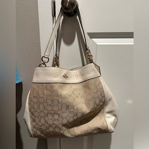 White and beige coach purse